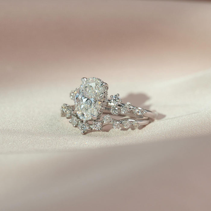 Contoured wedding band curving around the oval centre stone