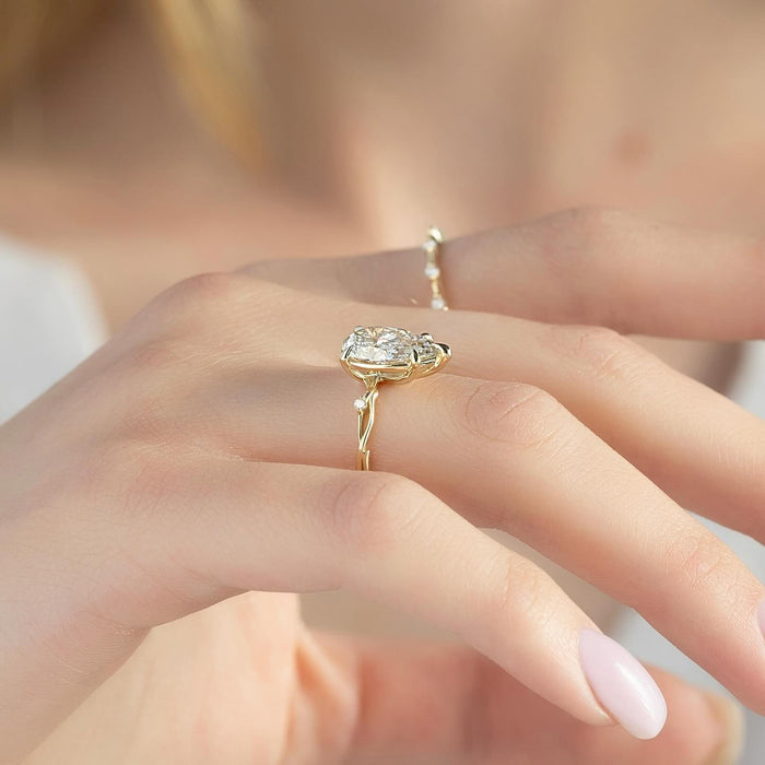 East west pear lab grown diamond ring worn on the hand