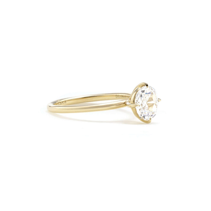 Side profile of a round rose cut lab grown diamond in four fine claws