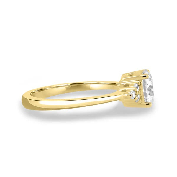 Round cut diamond pear side stone trilogy ring gallery view