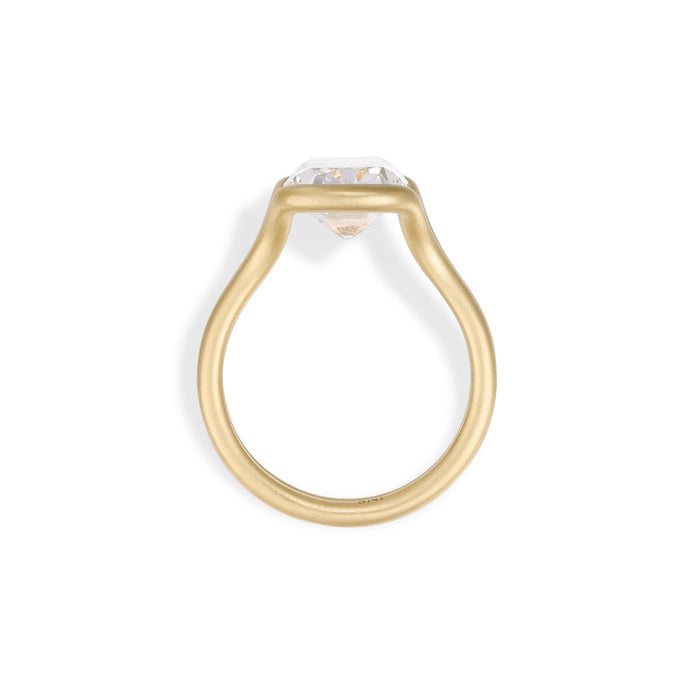 Old mine cut lab grown diamond in a matte sculptural wave bezel ring in gold