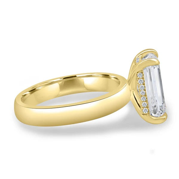 Hidden halo visible beneath emerald cut on cigar band side profile