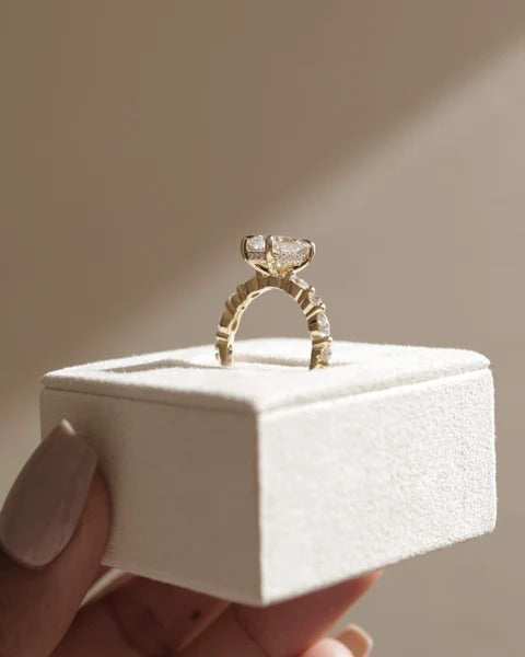 Elongated cushion diamond ring marquise accent band detail