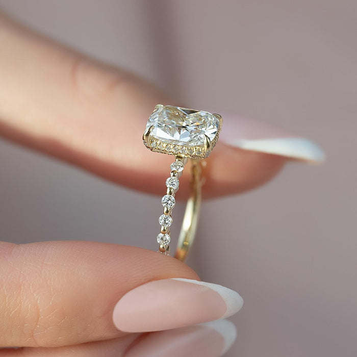 Profile of the elongated cushion ring showing the hidden halo and shared prong accents