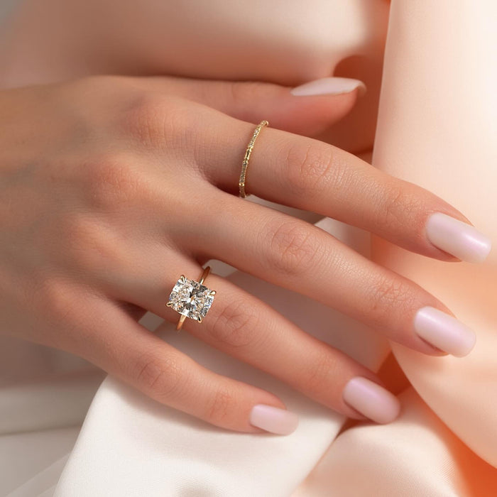 Low profile cushion cut diamond engagement ring detail