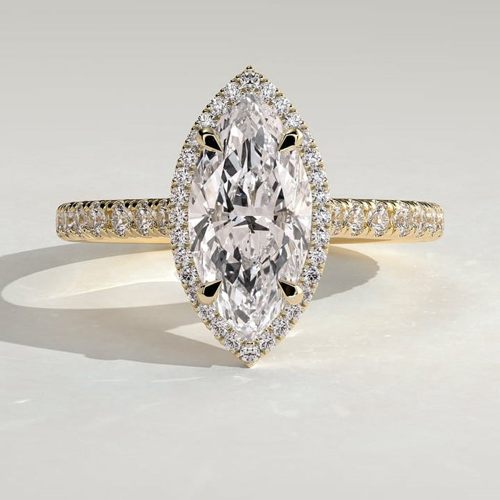 Marquise cut lab grown diamond halo ring on a pave band in yellow gold