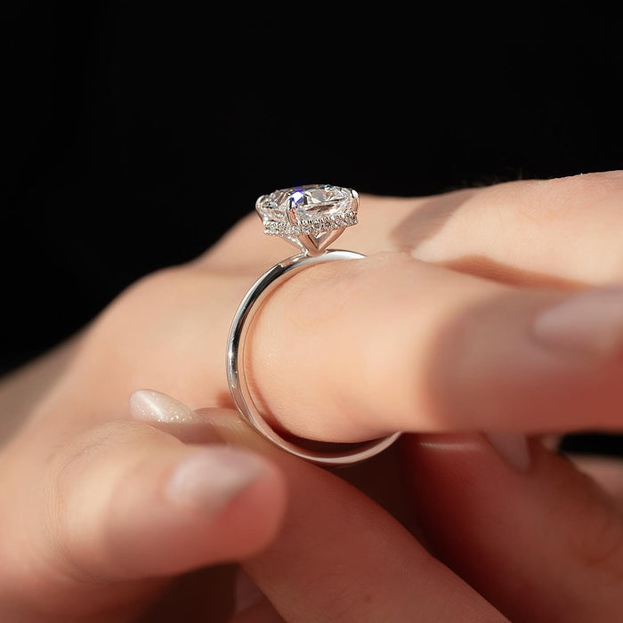 Elongated cushion moissanite ring profile showing hidden halo in white gold