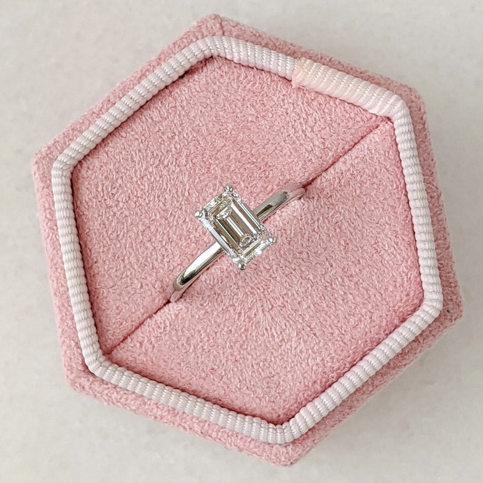 Emerald cut lab grown diamond hidden halo solitaire ring in white metal