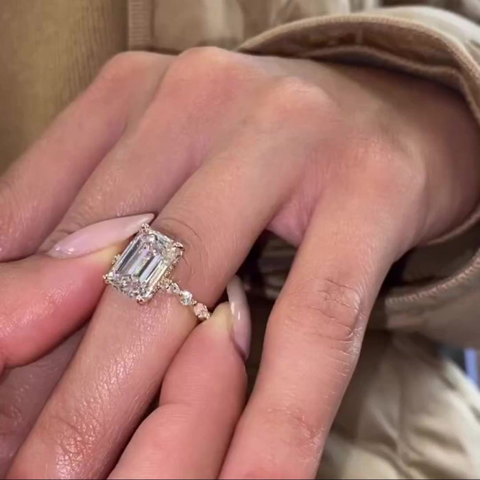 Handmade emerald cut moissanite hidden halo promise ring, angled view