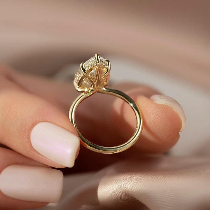 Back view of pear moissanite ring showing hidden halo and claw prongs