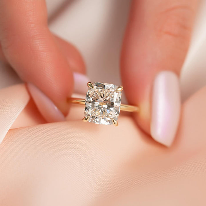 Elongated cushion moissanite hidden halo solitaire ring in yellow gold