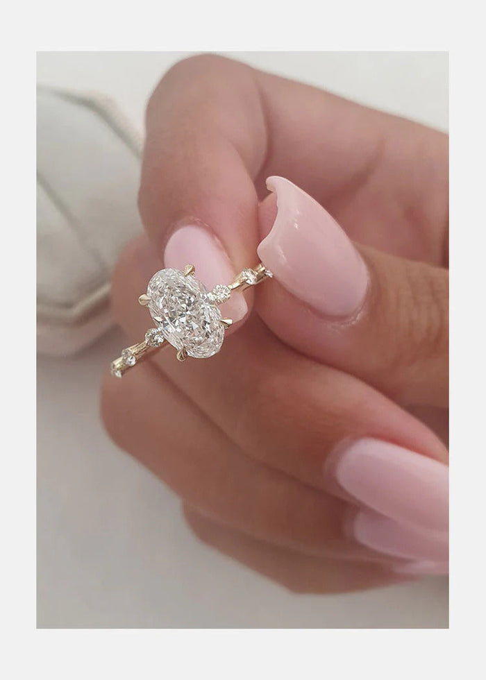 Handmade oval moissanite bridal ring, angled view