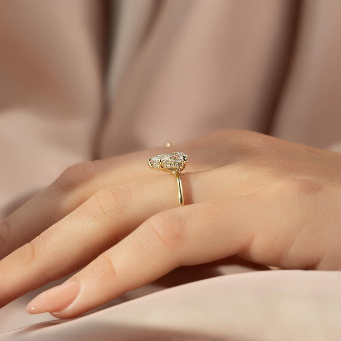 Pear Moissanite Hidden Halo Dainty Band Ring in 14K Gold on hand