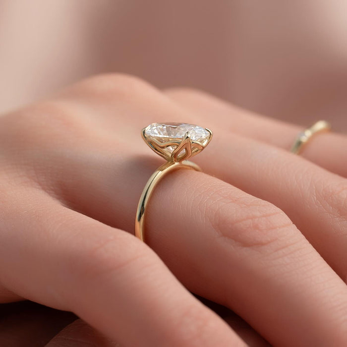 Oval Moissanite Hidden Halo Claw Prong Solitaire Ring in 14K Gold side profile