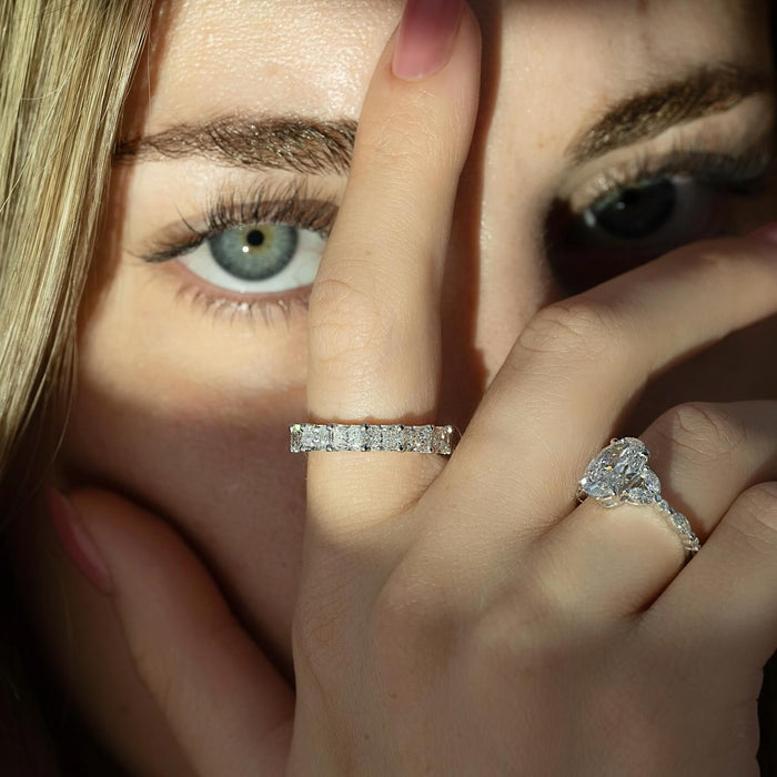 Radiant Cut Moissanite Full Eternity Wedding Band in 14K Gold on hand with engagement ring
