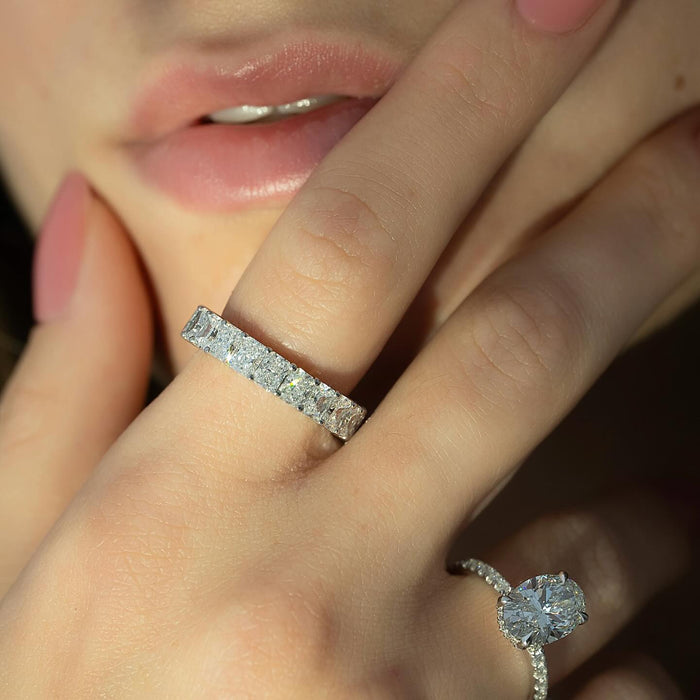 Oval Moissanite Hidden Halo Pave Band Ring in 14K Gold styled on model