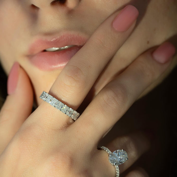 Radiant Cut Moissanite Shared Prong Eternity Band in 14K Gold on hand