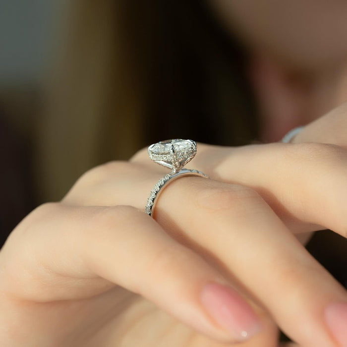 Oval Moissanite Hidden Halo Pave Solitaire Ring in 14K Gold side profile