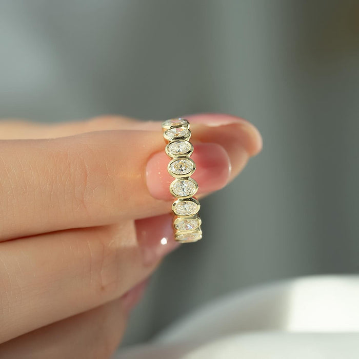 Oval Moissanite Bezel Set Eternity Wedding Band in 14K Gold