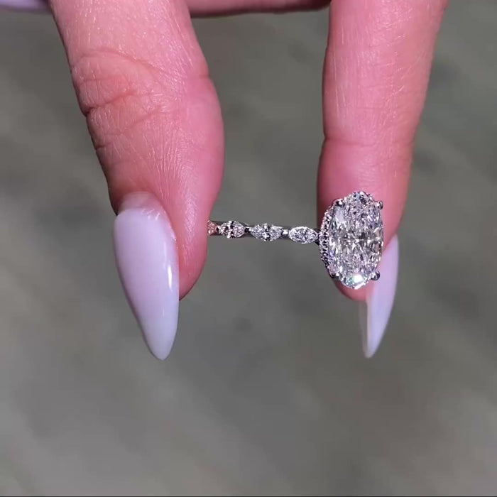 Oval brilliant cut moissanite bridal ring, angled view