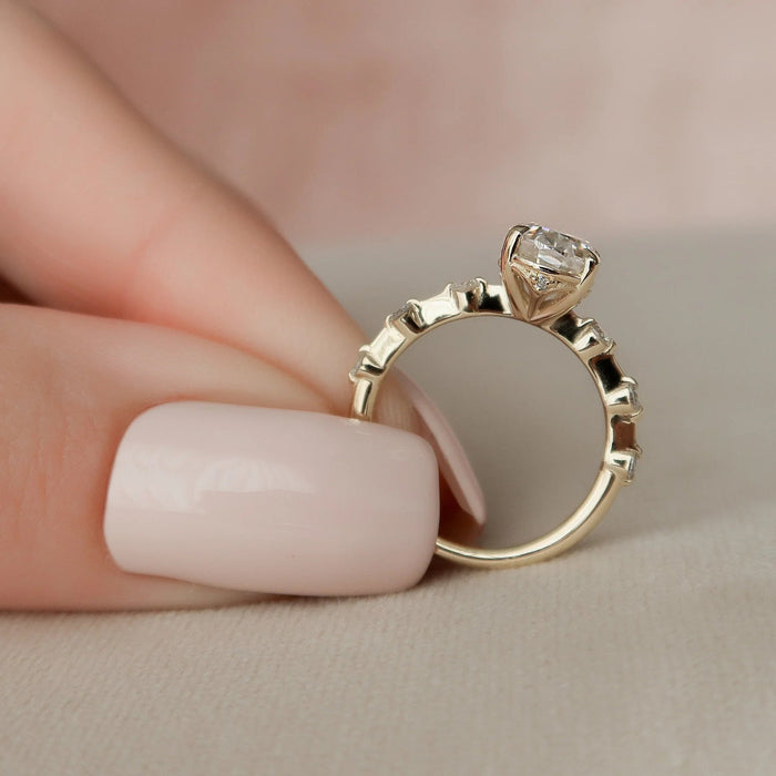 Classic gold oval moissanite solitaire anniversary ring, angled view