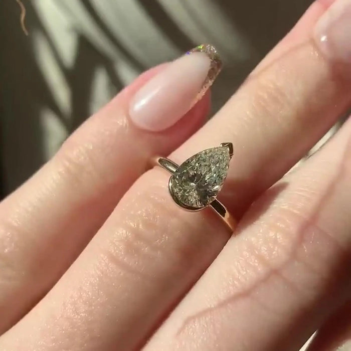 Pear Cut Moissanite Half Bezel Solitaire Engagement Ring in 14K Gold — Mapple Gems
