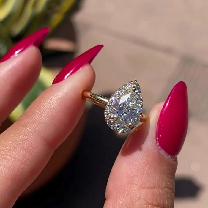 Pear moissanite halo ring teardrop detail in yellow gold — Mapple Gems