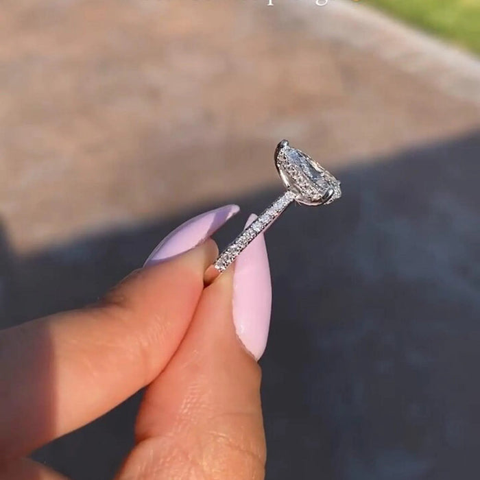 Pear moissanite hidden halo pave ring side view in white gold — Mapple Gems