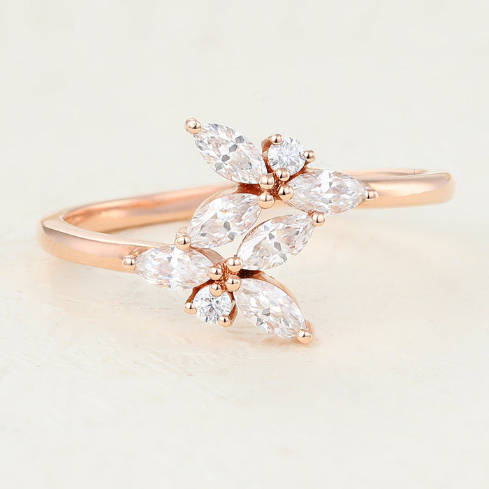 Rose gold leaf cluster moissanite band with six marquise stones and two small round stones, angled view