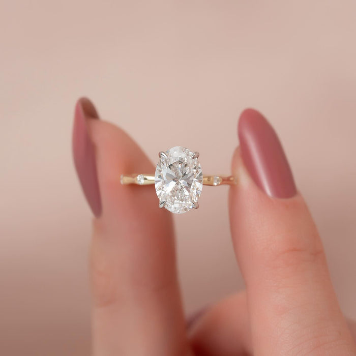 Front view of oval moissanite ring with bamboo accent band
