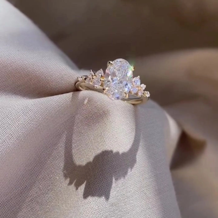 Vintage art deco oval moissanite cluster ring, angled view