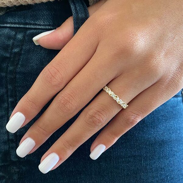 Marquise and round moissanite eternity band on hand