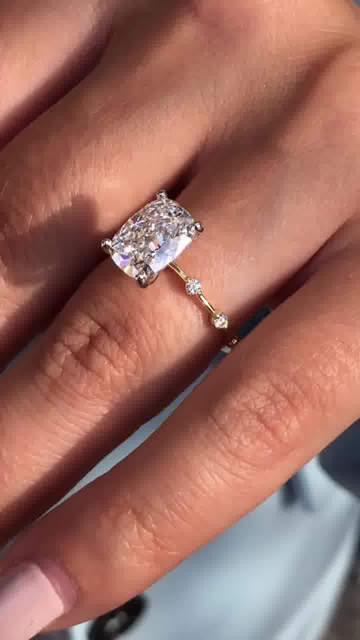Distance pave diamond cushion moissanite wedding ring, angled view
