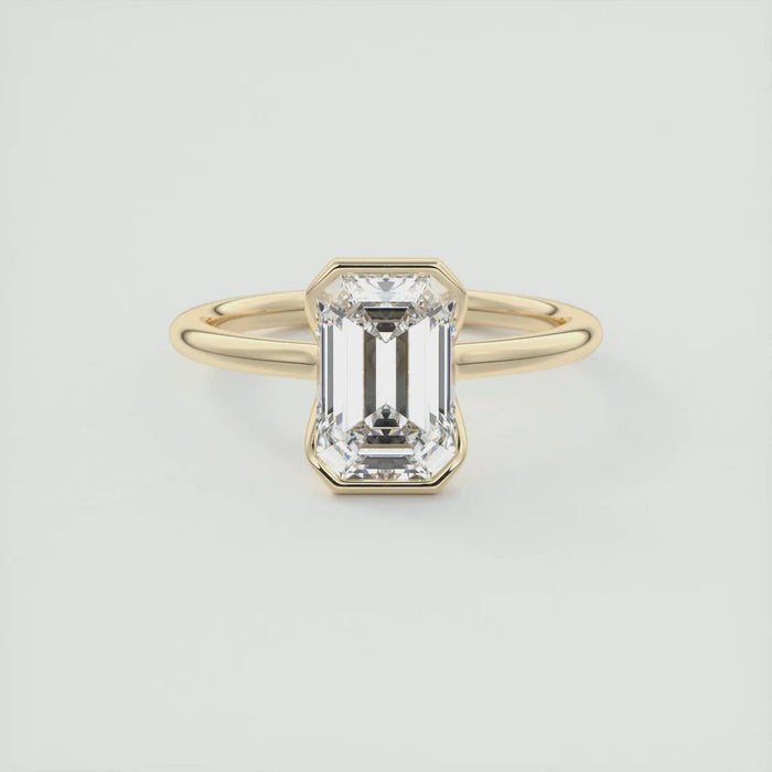 2.00 CT emerald cut moissanite half bezel engagement ring in gold