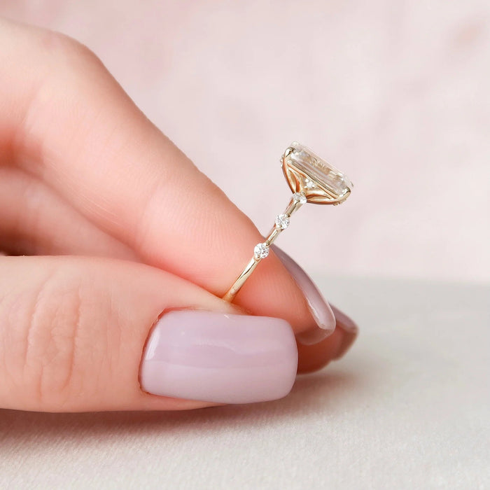 Distance pave emerald moissanite bridal ring, angled view