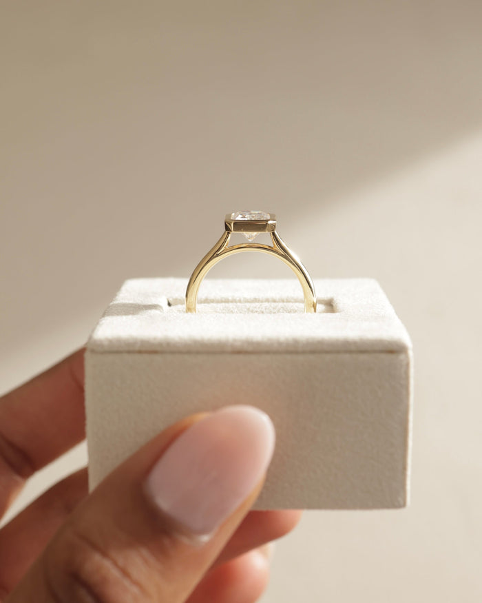Radiant Cut Moissanite Bezel Set Solitaire Engagement Ring with Polished Gold Band - view 2