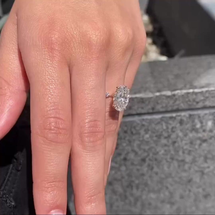 Conflict-free oval cut moissanite bridal ring, angled view