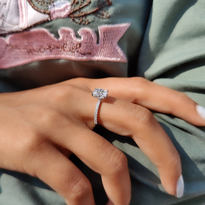Pave set diamond shoulders leading up to a cushion cut lab grown diamond