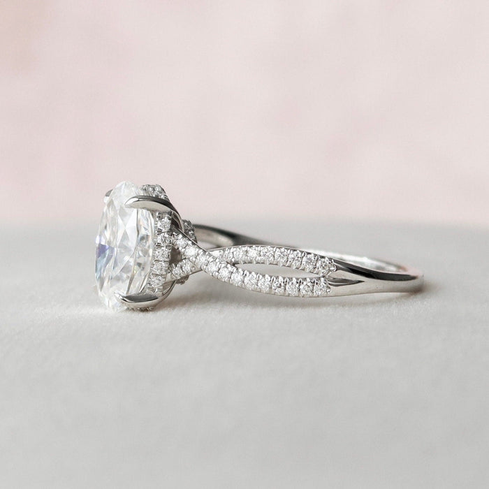 Hidden halo elongated oval moissanite ring, angled view