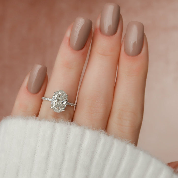 Classic oval cut moissanite bridal ring, angled view