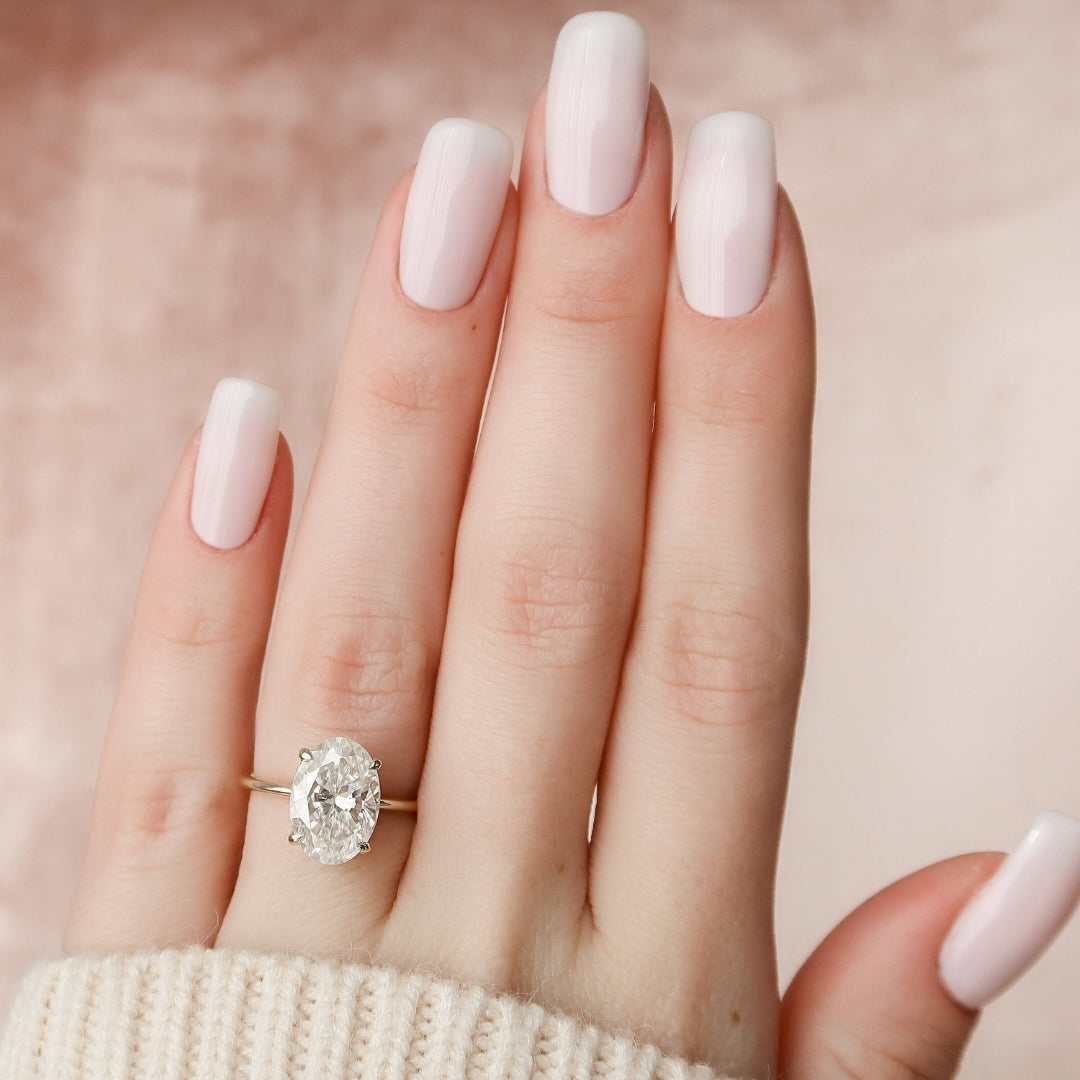 Dainty 4 Prong Claw Moissanite Ring