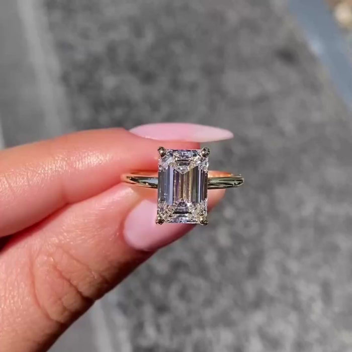 3.5 ct emerald cut moissanite hidden halo engagement ring in gold