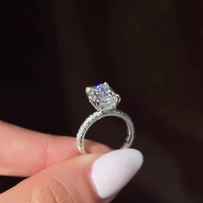 Handmade emerald cut moissanite solitaire ring, angled view