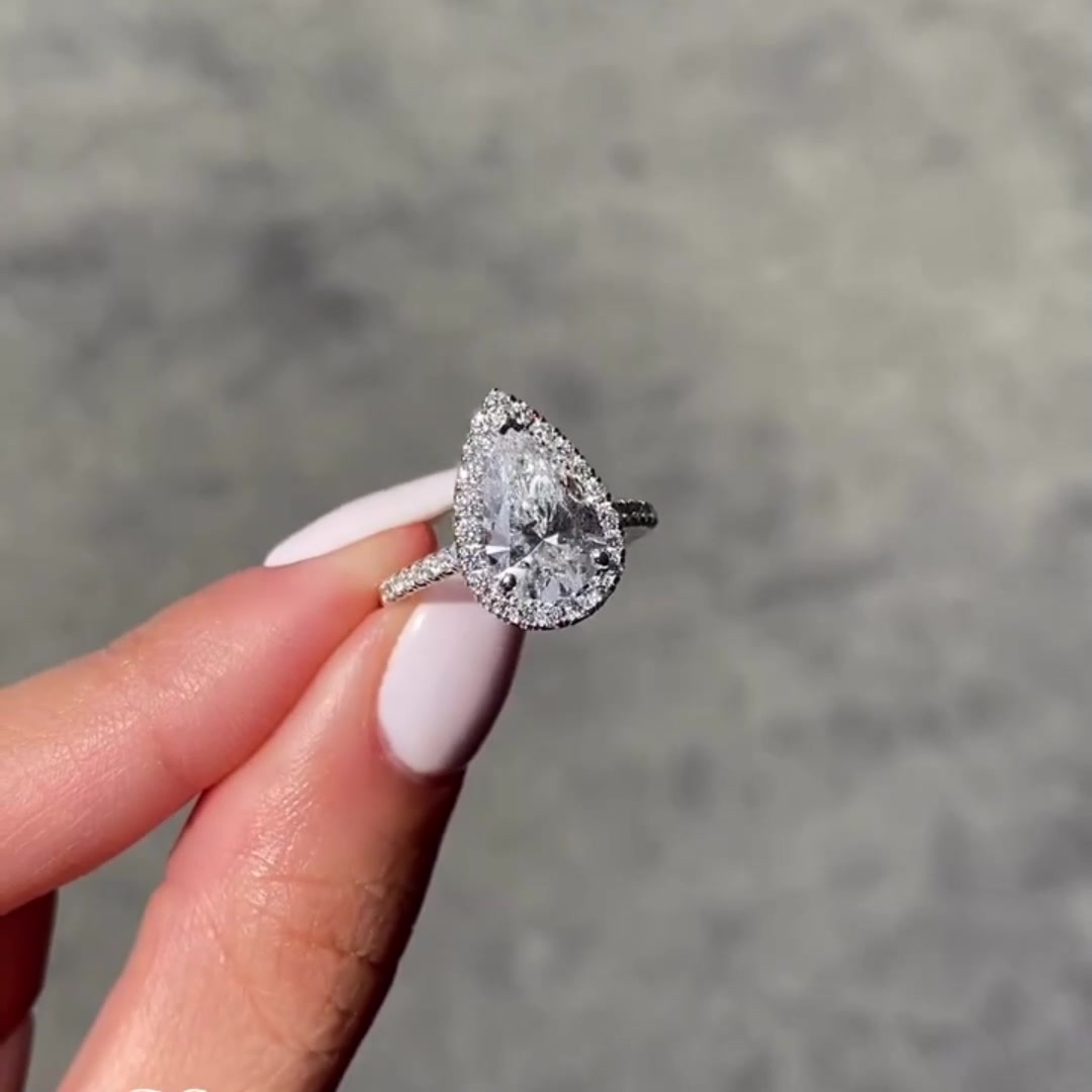 Unique Diamond Halo Pear Moissanite Ring