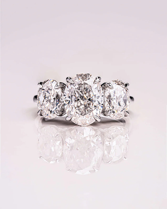 Three stone oval moissanite engagement ring in gold