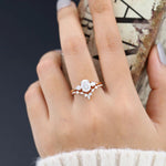 Load image into Gallery viewer, Oval Moissanite Engagement Ring with Two Accent Stones and Matching Band