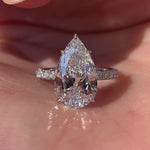 Load image into Gallery viewer, Pear Shaped Moissanite Hidden Halo Engagement Ring