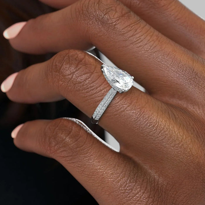 Sparkling pear moissanite stacking wedding ring for her, angled view