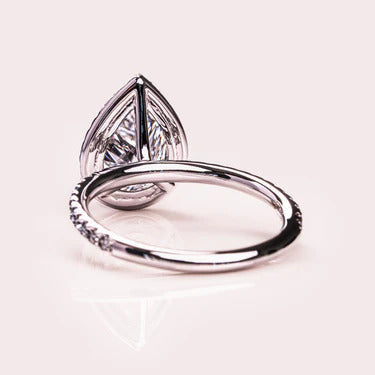 Handmade pear moissanite halo wedding ring, angled view