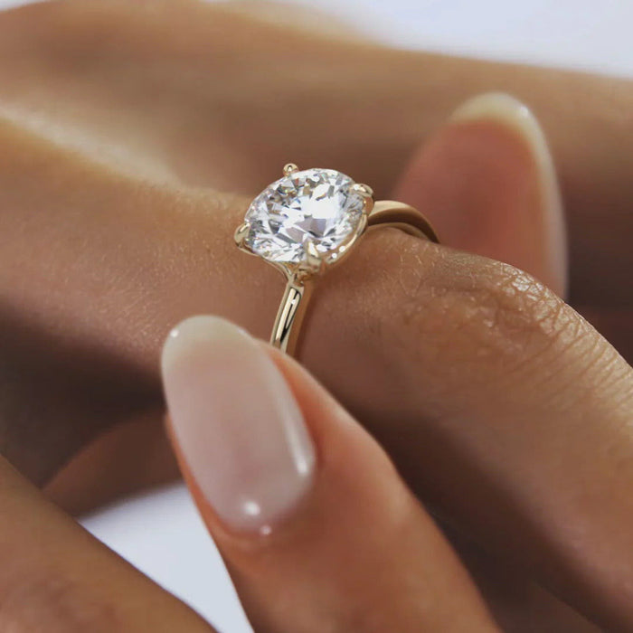 Classic round moissanite wedding ring for women, angled view